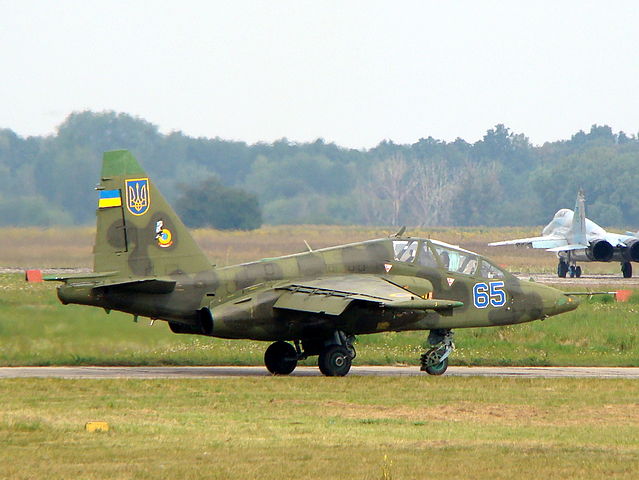 Ukrainian Air Force Su-25UB with two MiG-29s 9-13 in background copy