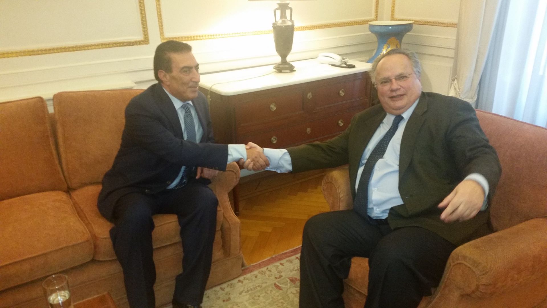 Atef Tarawneh, left, shakes hands with Greece’s then-Minister of Foreign Affairs Nikus Kotzias on March 3, 2016. Credit: Hellenic Ministry of Foreign Affairs