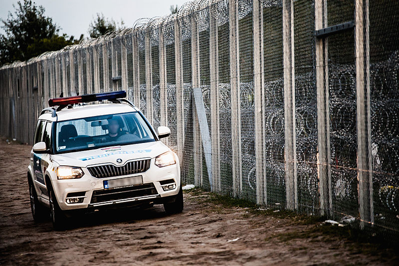 Police car at Hungary-Serbia border barrier