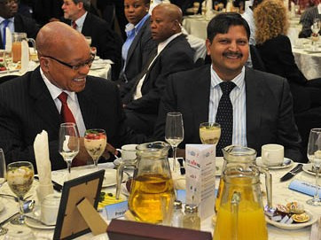 Former South African president Jacob Zuma dines with Atul Gupta (right) during an SABC business briefing, Port Elizabeth, South Africa, March 2012. Credit: GovernmentZA / Flickr