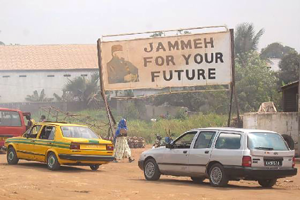 Jammeh_Billboard.jpg. Caption: A billboard praising former President Yahya Jammeh in Serekunda, 2005. Credit: Atamari / Wikimedia Commons
