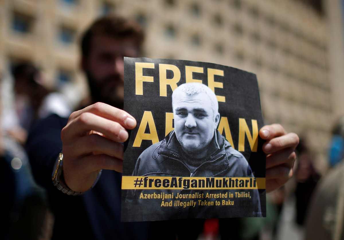 ournalists rally to support newly imprisoned Azerbaijani journalist Afgan Mukhtarli in Tbilisi on May 31. (Photo: Mzia Saganelidze for RFE/RL)