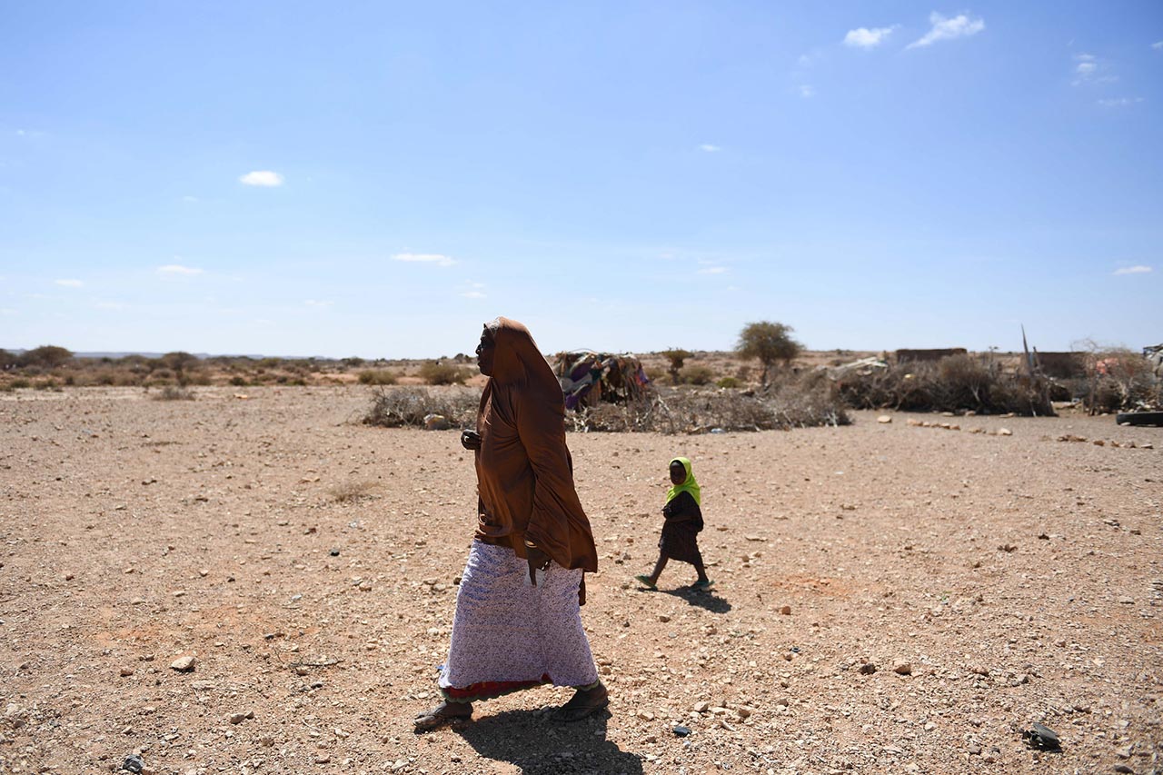 A woman walks in drought-hit Salaxley village, 15 kilometers south of Garowe in Puntland, on February 01 2017. Puntland is one of the regions hit by a severe drought. UN Photo / Ilyas Ahmed